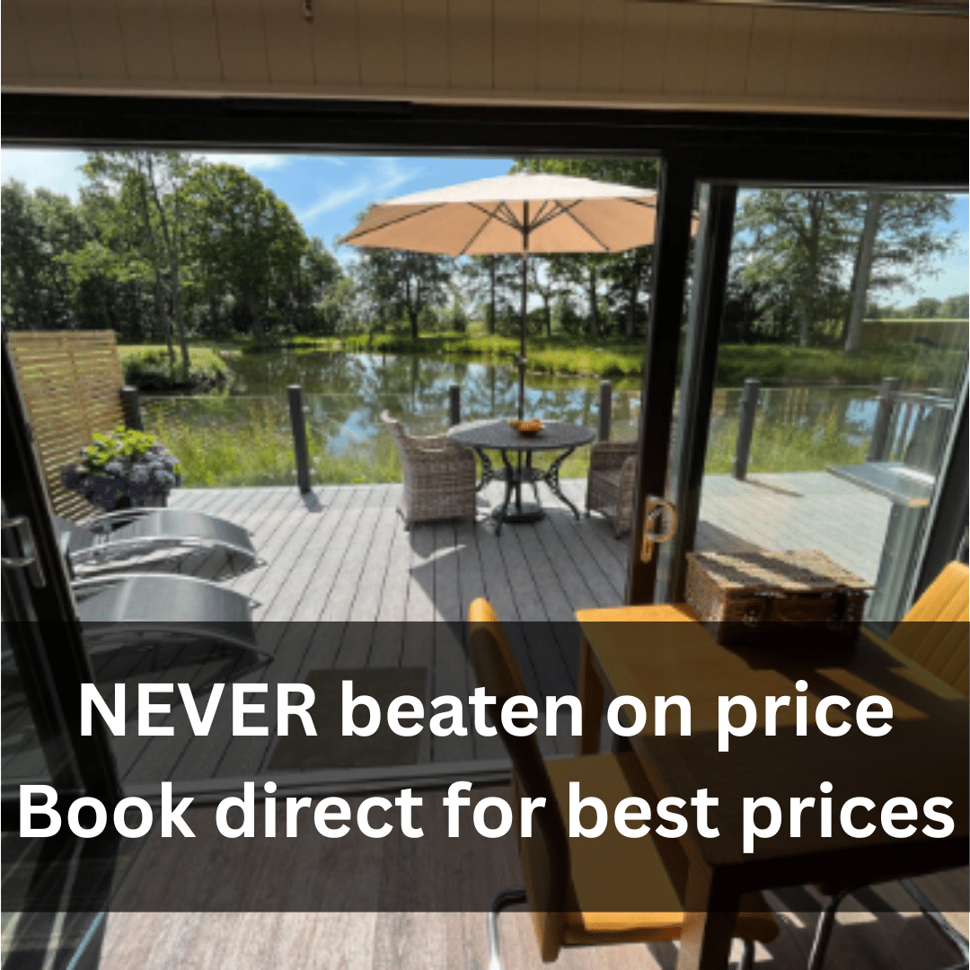 hot tub holidays at Woodland Lakes holiday lodges York - never beaten on price Lakeside view from a holiday lodge at Woodland Lakes, featuring outdoor seating, an umbrella, and a message promoting best price guarantees for direct bookings.